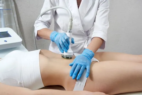 Lost the Weight but Not the Loose Skin? 2 woman having HIFU treatment on her stomach to combat loose skin Newcastle following weight loss